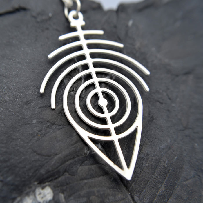 Primitive Pendant in cherry on leather cord